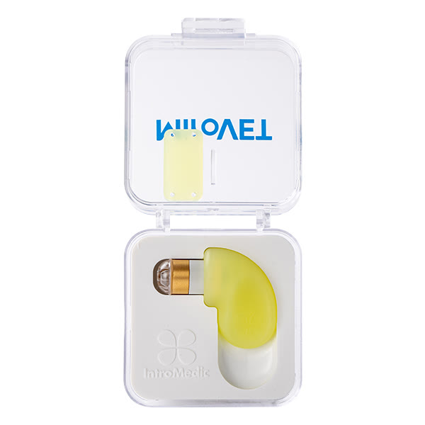 A capsule inside its clear case